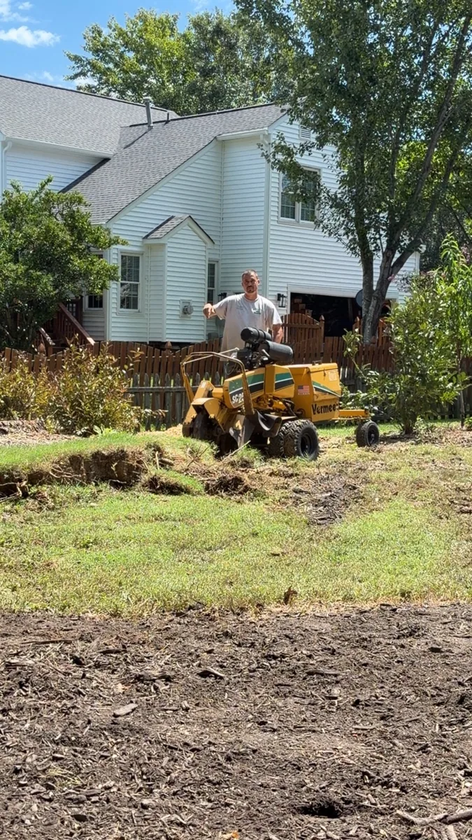 Travis operating stump grinding equipment